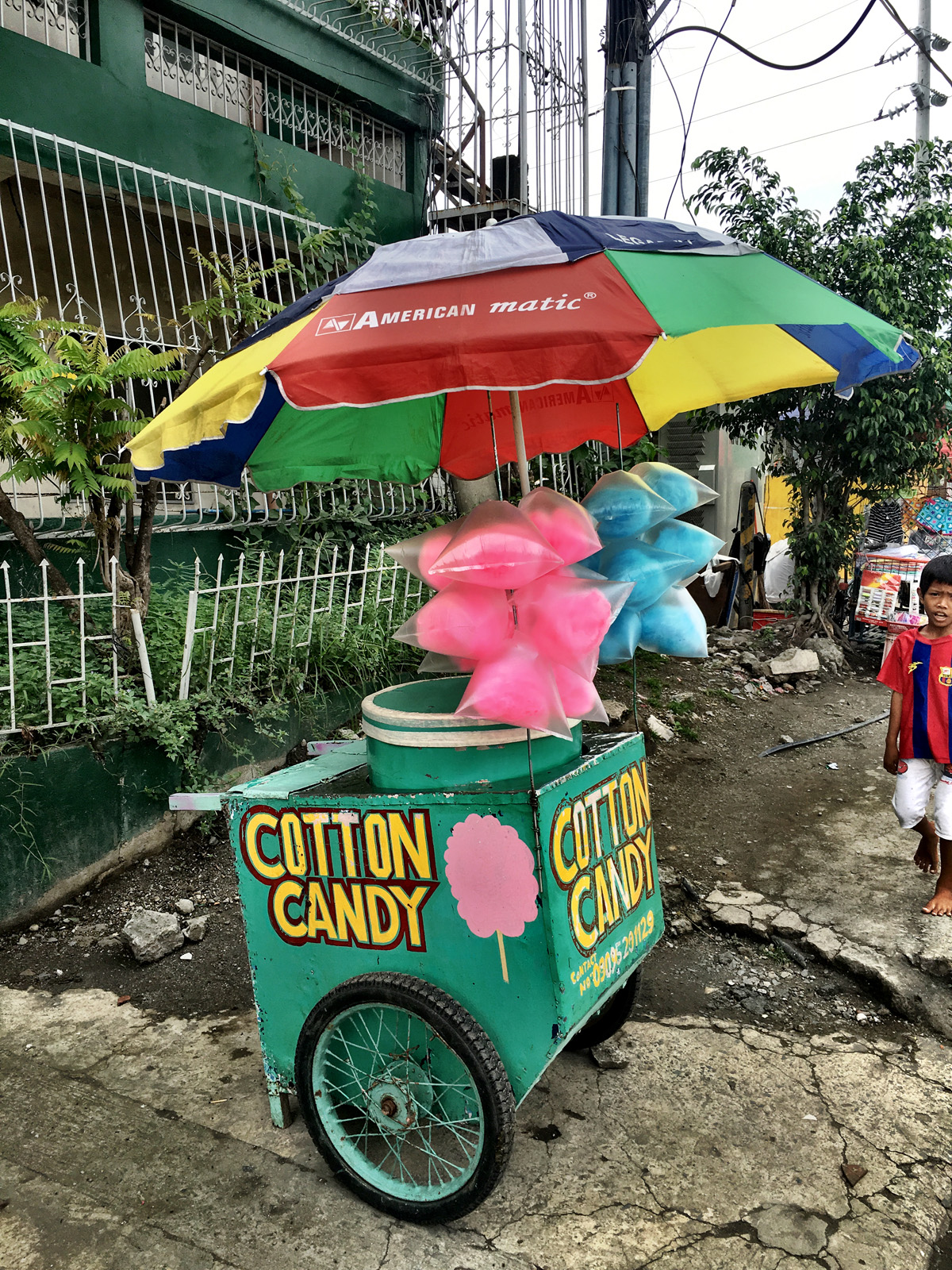 Cotton candy vendor on the side of the road.